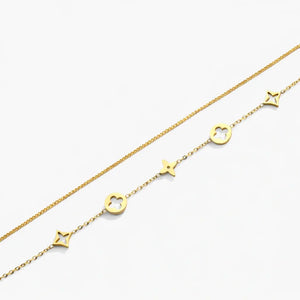 18K gold plated bracelet with star and floral charms on delicate chain, on white background
