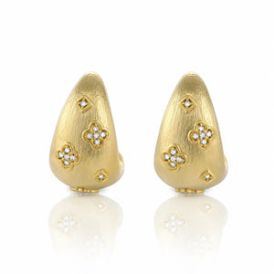 Pair of gold earrings with diamond accents on a white background