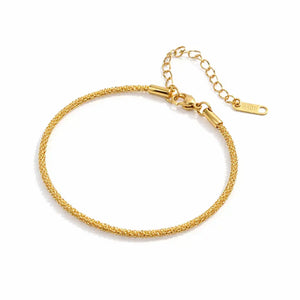 Gold bracelet on a white background