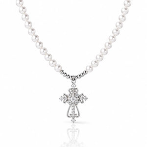 Pearl necklace with a silver cross pendant on a white background