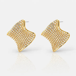 Gold and diamond earrings on a white background