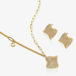 Gold necklace and earrings set on a white background