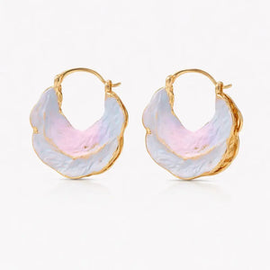 Gold hoop earrings with multicolored stone centers on a white background