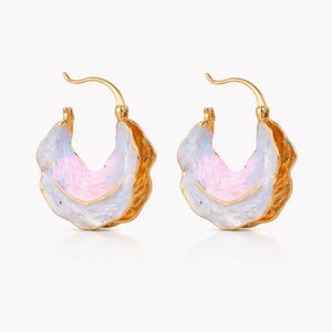 Hoop earrings with gold and multicolored stone design on a white background