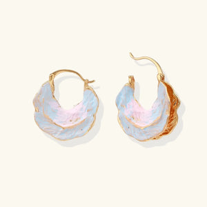 Gold hoop earrings with pastel blue and pink gradient on a white background