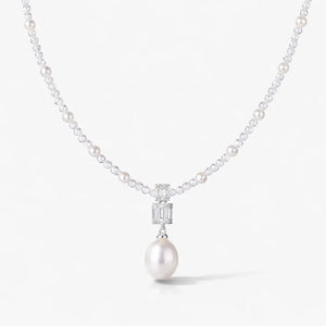 Silver pearl drop necklace with gemstone accents and elegant pearl strand
