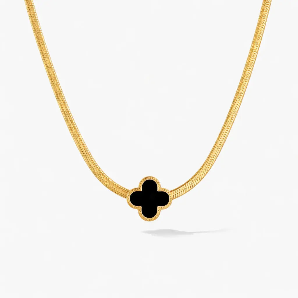 18K gold necklace with black clover-shaped pendant on snake chain, elegant jewelry