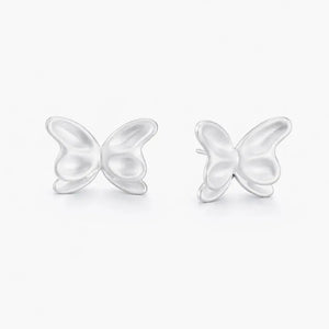 Butterfly-shaped silver earrings on a white background
