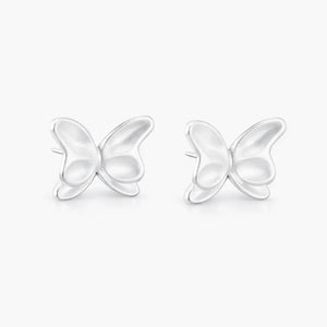 Butterfly-shaped silver earrings on a white background