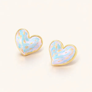 Heart-shaped earrings with a pastel color scheme on a white background