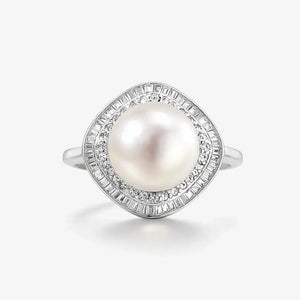 Silver ring with a large round pearl center and baguette-cut diamond halo on white background