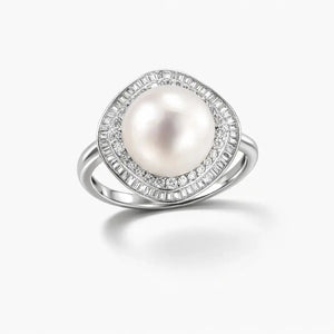 Silver ring with large round pearl center and halo of clear baguette and round gemstones