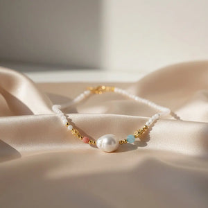 18K gold vermeil necklace with white pearl, pastel beads, and textured gold accents