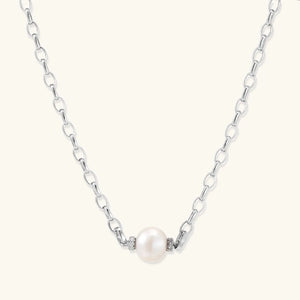 Pearl necklace with silver chain on a white background
