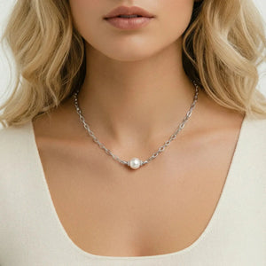 Pearl necklace on a model with a neutral background