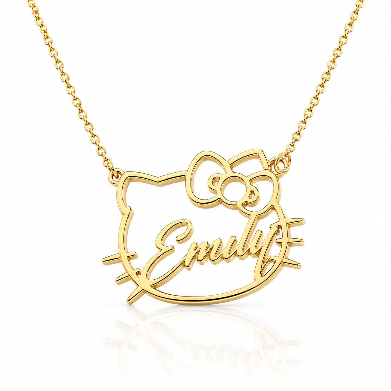 A gold necklace featuring a custom name pendant in the shape of a cartoon cat face with a bow, with the name 'Emily' written in cursive script, shown on a white background with a soft reflection.