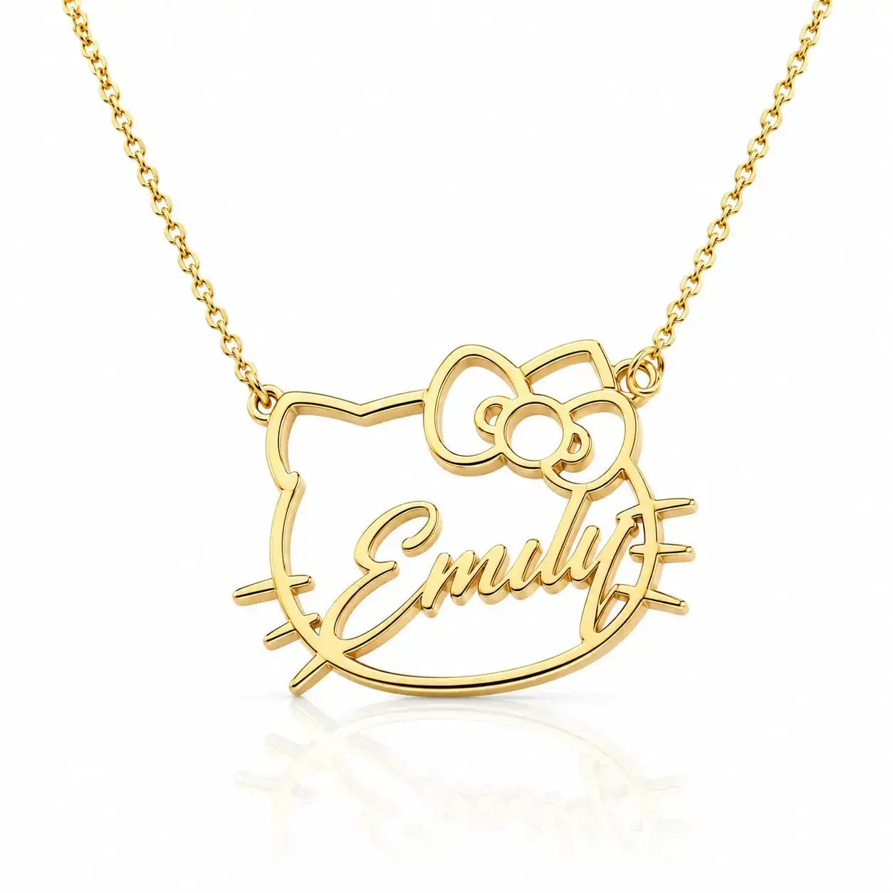 A gold necklace featuring a custom name pendant in the shape of a cartoon cat face with a bow, with the name 'Emily' written in cursive script, shown on a white background with a soft reflection.