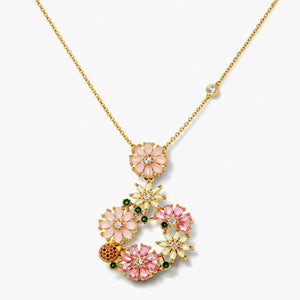 14K gold plated necklace with pink and white floral crystal pendant on a white background
