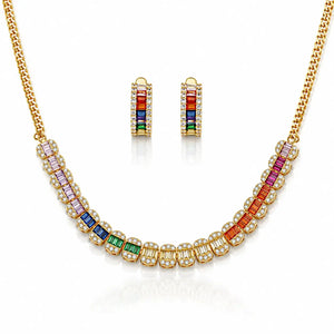 Gold necklace and matching drop earrings set with colorful baguette gemstones in pink, purple, blue, green, and red, accented with clear stones on a white background.
