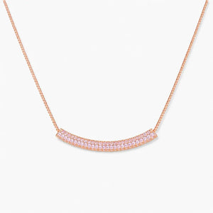 Rose gold plated necklace with curved bar pendant set with small clear cubic zirconia stones