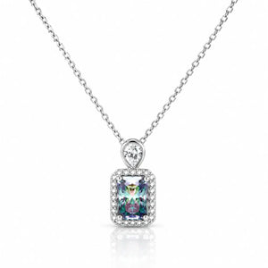 A silver-toned necklace with a rectangular iridescent gemstone pendant surrounded by a halo of small clear stones, suspended from a delicate silver chain on a white background.
