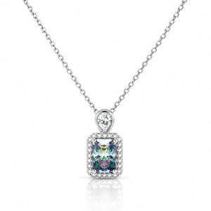 A silver-toned necklace with a rectangular iridescent gemstone pendant surrounded by a halo of small clear stones, suspended from a delicate silver chain on a white background.