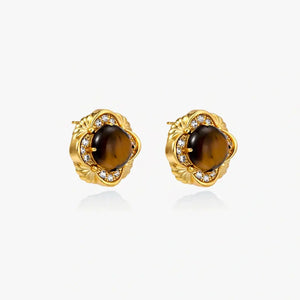 18K gold stud earrings with round tiger eye stones and diamond accents on a white background