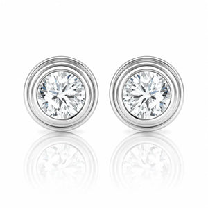 Pair of diamond stud earrings on a white background