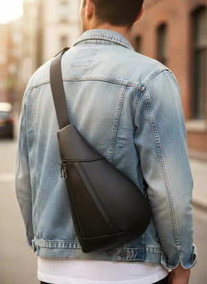 Ryder men’s genuine leather chest shoulder crossbody bag in Coffee, Brown, or Black with top zipper and adjustable strap.