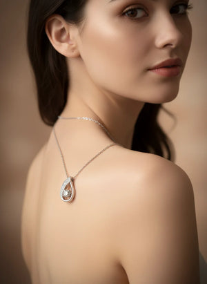 Serenova S925 silver smart pendant necklace with dancing sparkle, CZ inlay, adjustable 21–50 cm chain—heart, droplet, U-shape, and cross styles.