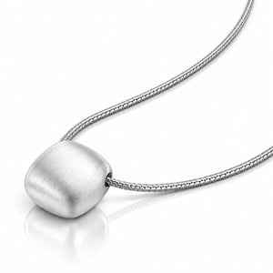 A silver pendant necklace featuring a rounded, brushed metal disc on a textured snake chain, displayed on a clean white background with a soft reflection.