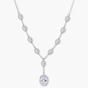 White gold plated Y-drop necklace with oval and round clear cubic zirconia stones on a white background