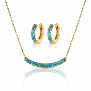 Gold jewelry set featuring a curved bar necklace and matching hoop earrings, both adorned with rows of bright turquoise-blue stones on a clean white background.
