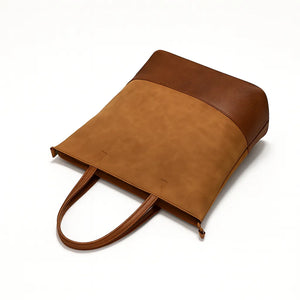 Women’s large color-block PU messenger tote with zipper closure and shoulder strap in modern European–American style.