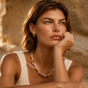 Woman with jewelry against a desert background
