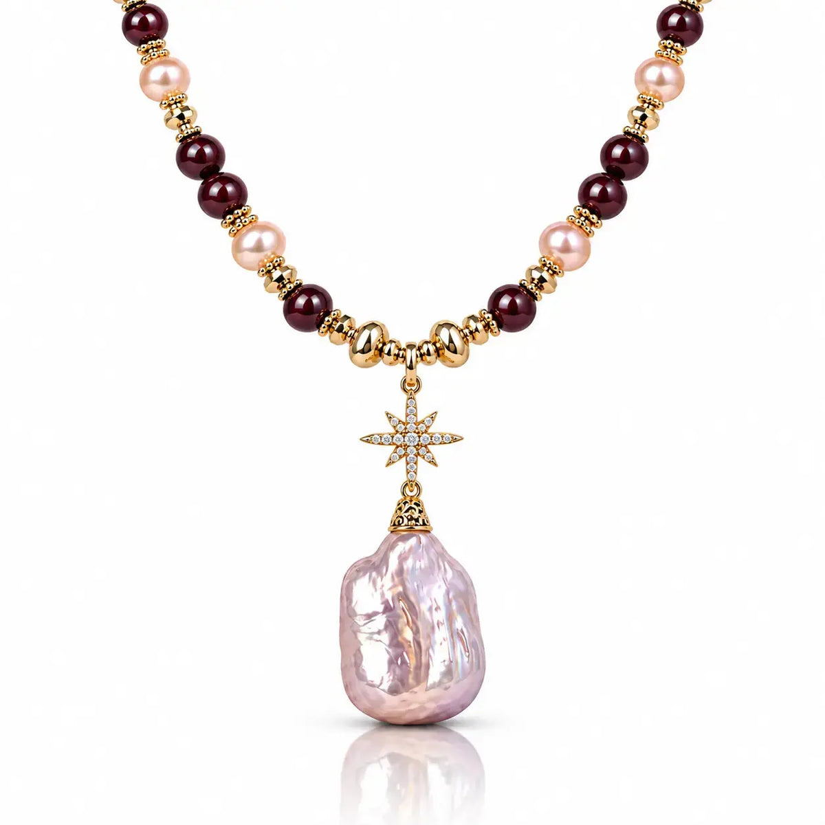 A luxury necklace featuring a large, irregular light pink baroque pearl pendant, suspended from a gold star charm. The chain is composed of alternating dark burgundy beads, light pink pearls, and polished gold spacer beads.