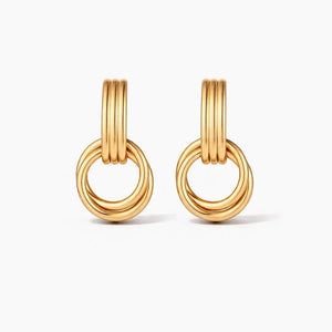 Gold double ring hoop earrings with modern layered design on white background