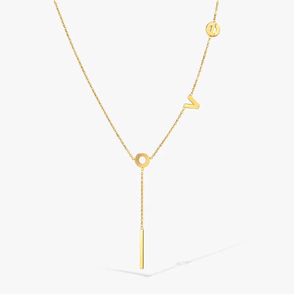 gold letter lariat necklace with LOVE letters on delicate chain, minimalist jewelry