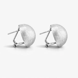 Textured dome-shaped silver stud earrings with modern geometric posts on a white background.