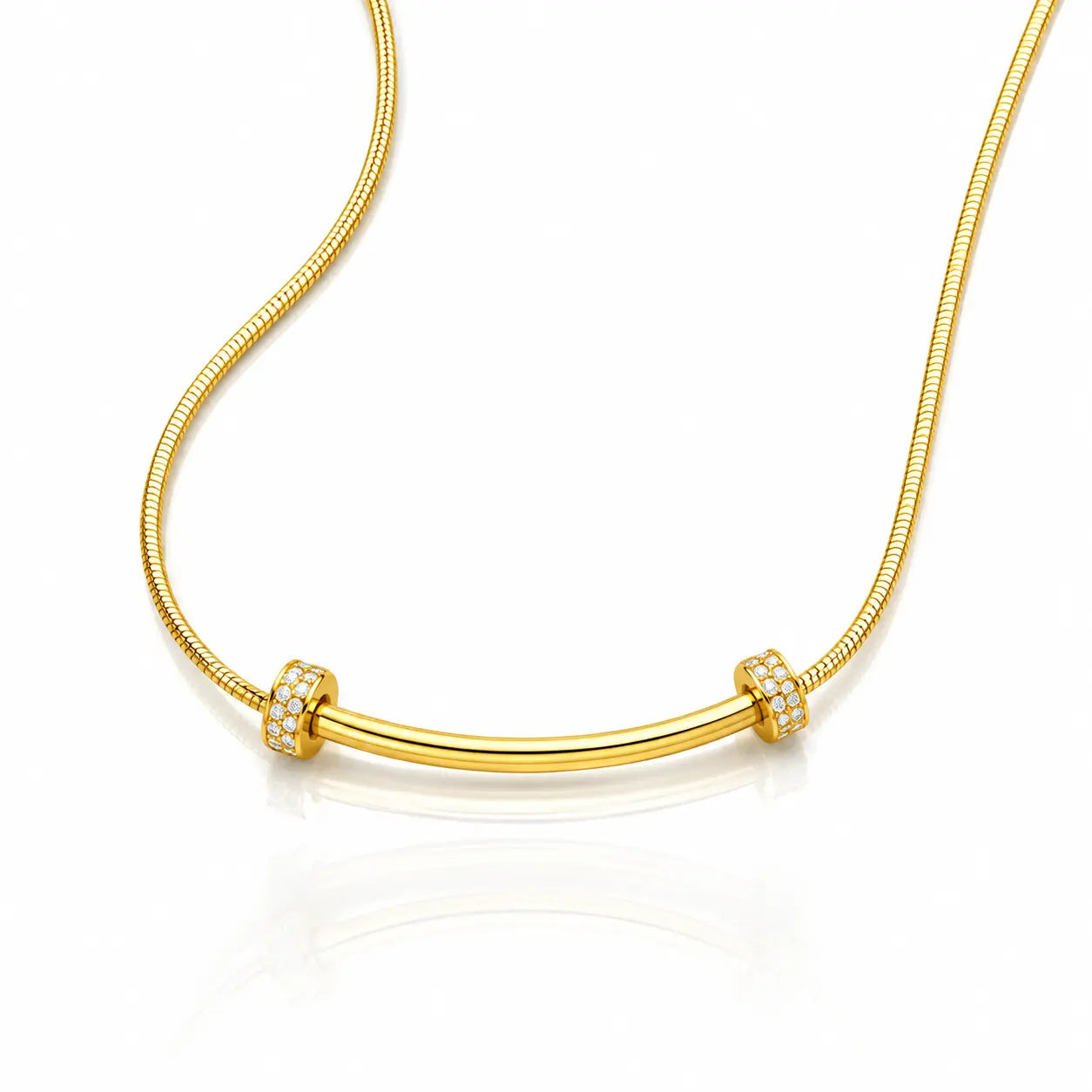 A gold snake chain necklace with a curved bar centerpiece, accented by two small square bezel-set crystal clusters on either end, shown on a white background with a soft reflection.