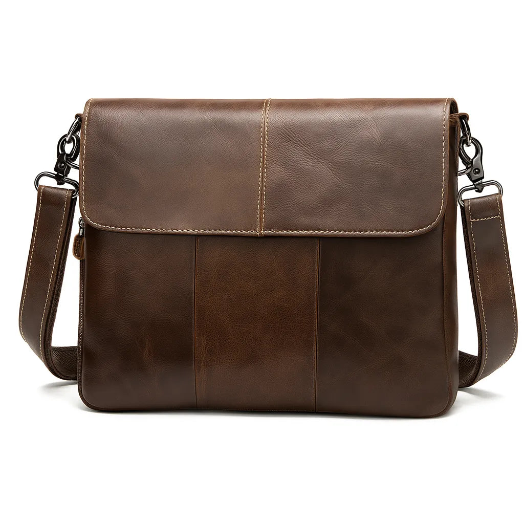 Archer unisex oil-wax leather crossbody messenger in coffee brown, worn across the body on a city street