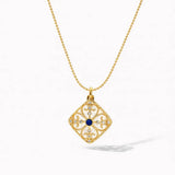 18K gold necklace with square medallion pendant, blue center stone, and intricate detailing
