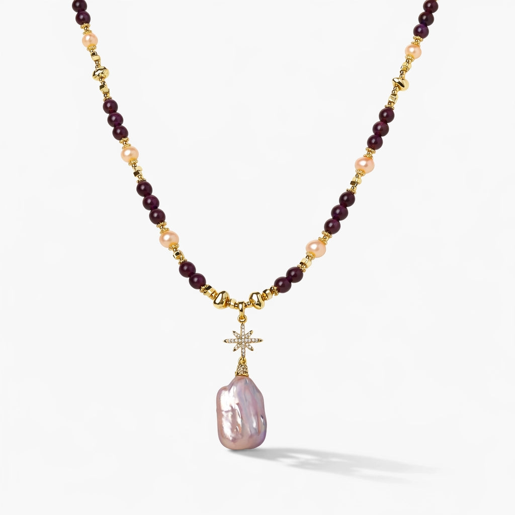 Necklace with purple and gold beads and a pink pendant on a white background