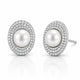 A pair of oval stud earrings featuring a central white pearl surrounded by double rows of small clear pavé stones in a silver-toned setting, shown on a white reflective background.
