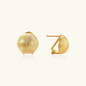 Gold earrings on a white background