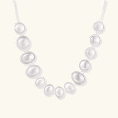 Pearl necklace on a white background