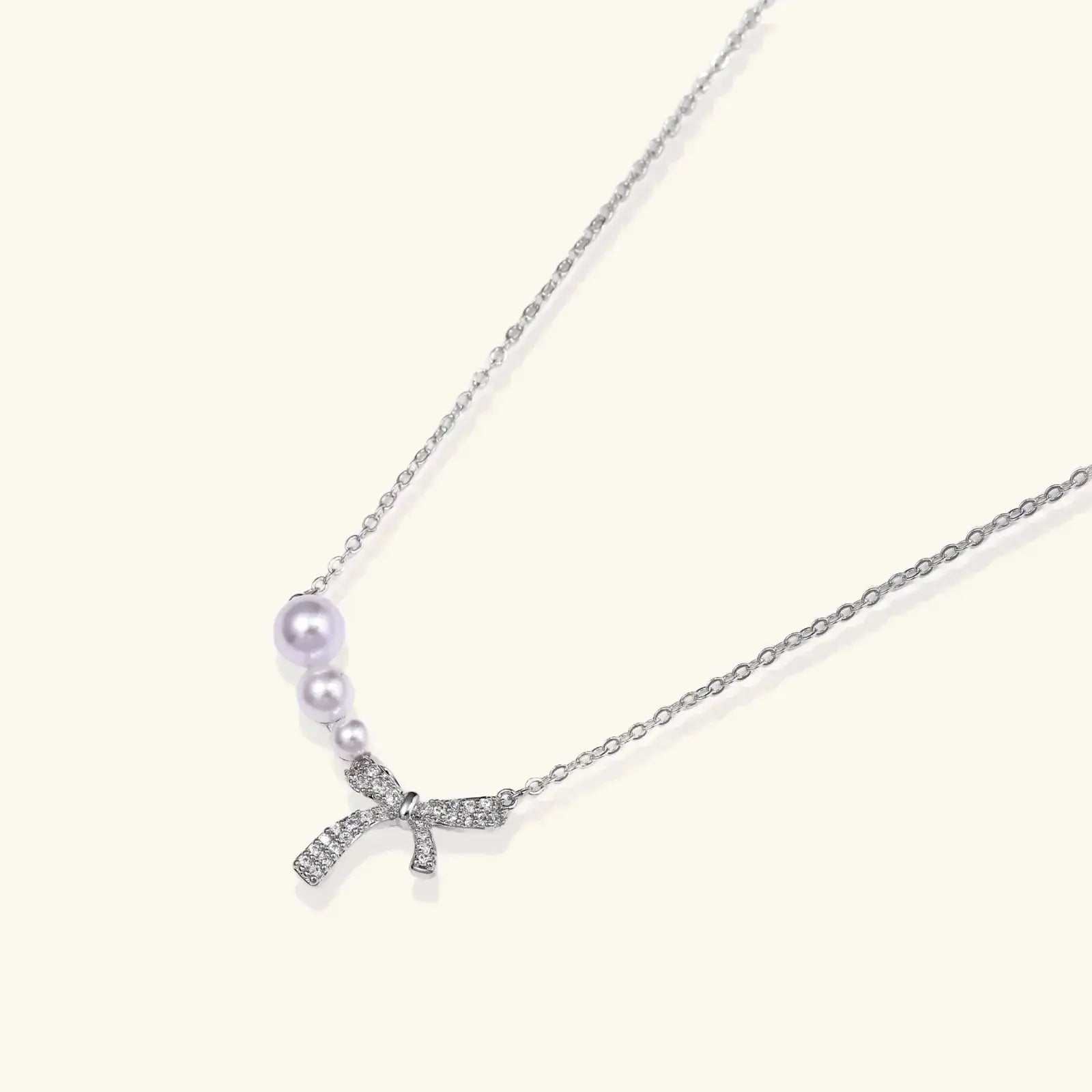 Necklace with a starfish pendant and pearl on a white background