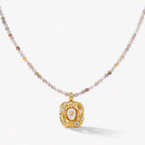 18K gold necklace with gemstone beaded chain and ornate square gemstone pendant