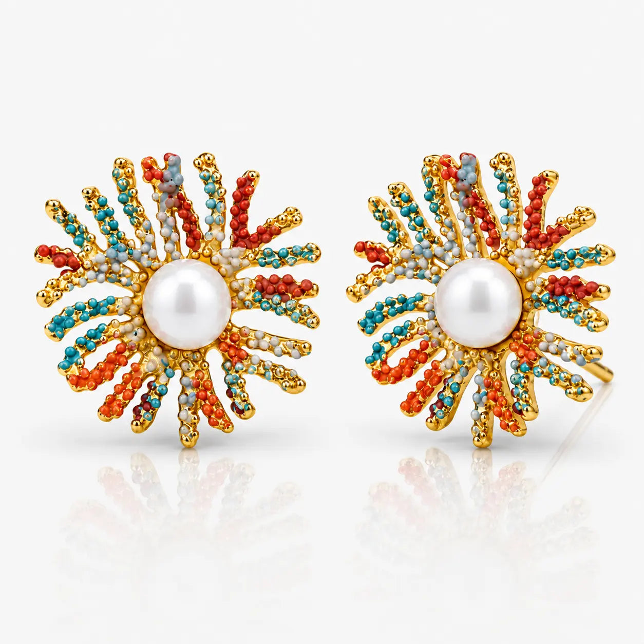 Pair of colorful beaded earrings with pearl center on a white background