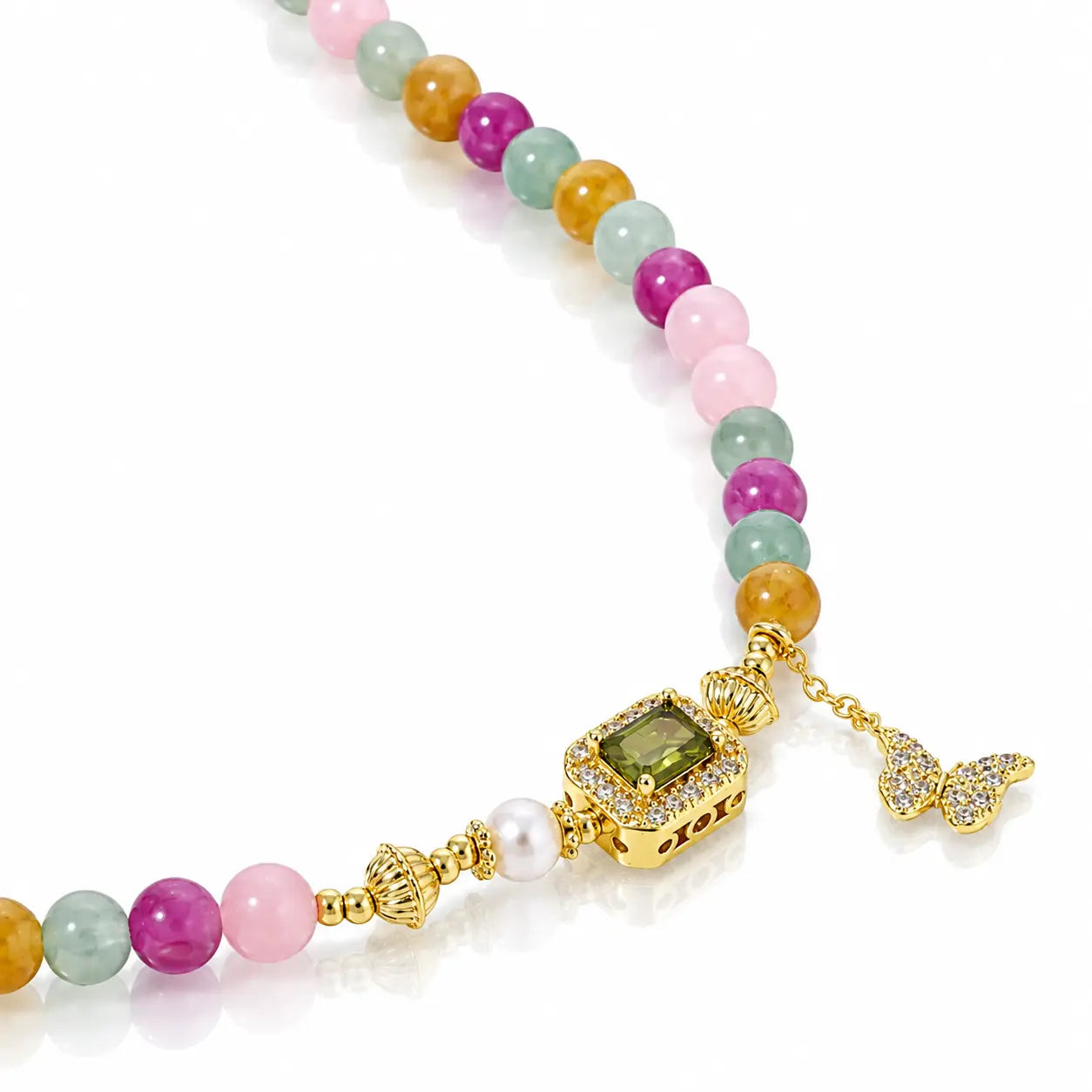 A gold-plated beaded necklace featuring a sequence of pastel and vibrant gemstone beads in pink, green, orange, and purple, accented by a central gold-plated rectangular pendant with a green gemstone, a small white pearl, and a butterfly charm.